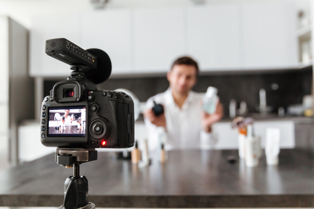 Young male recording a video for digital marketing purposes